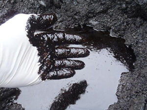 You don't have to dig deep to still find oil on some beaches in Prince William Sound as seen in this photo taken in 2011. NOAA Photo.