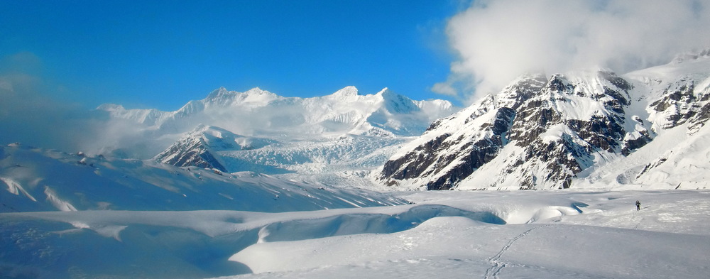 Katie Strong skiing through Wrangell-St. Elias National Park in the winter of 2015. The beauty and quiet she encountered are two reasons national parks are so special to her. Photo courtesy of Scott Peters.