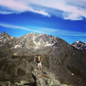 MIchael Harvey hiking in the mountains out of Hatcher's Pass.