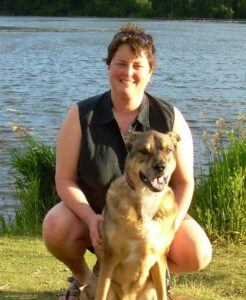 Vicki Clark and her dog Tamarack that came North with her to work at Trustees.