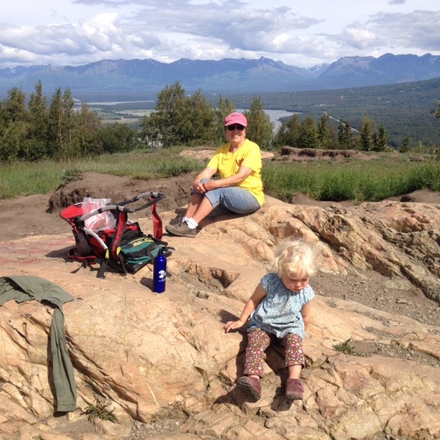 Judy Donegan, on the Board of the Castle Mountain Coalition, with her granddaughter on the Butte in the Matanuska Valley