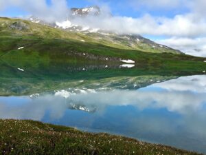A photo of Lost Lake mountains reflected in the lake.