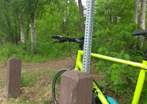 Kat bikes and then hikes from greenbelt to mountain top. Here's her bike at the trail head.