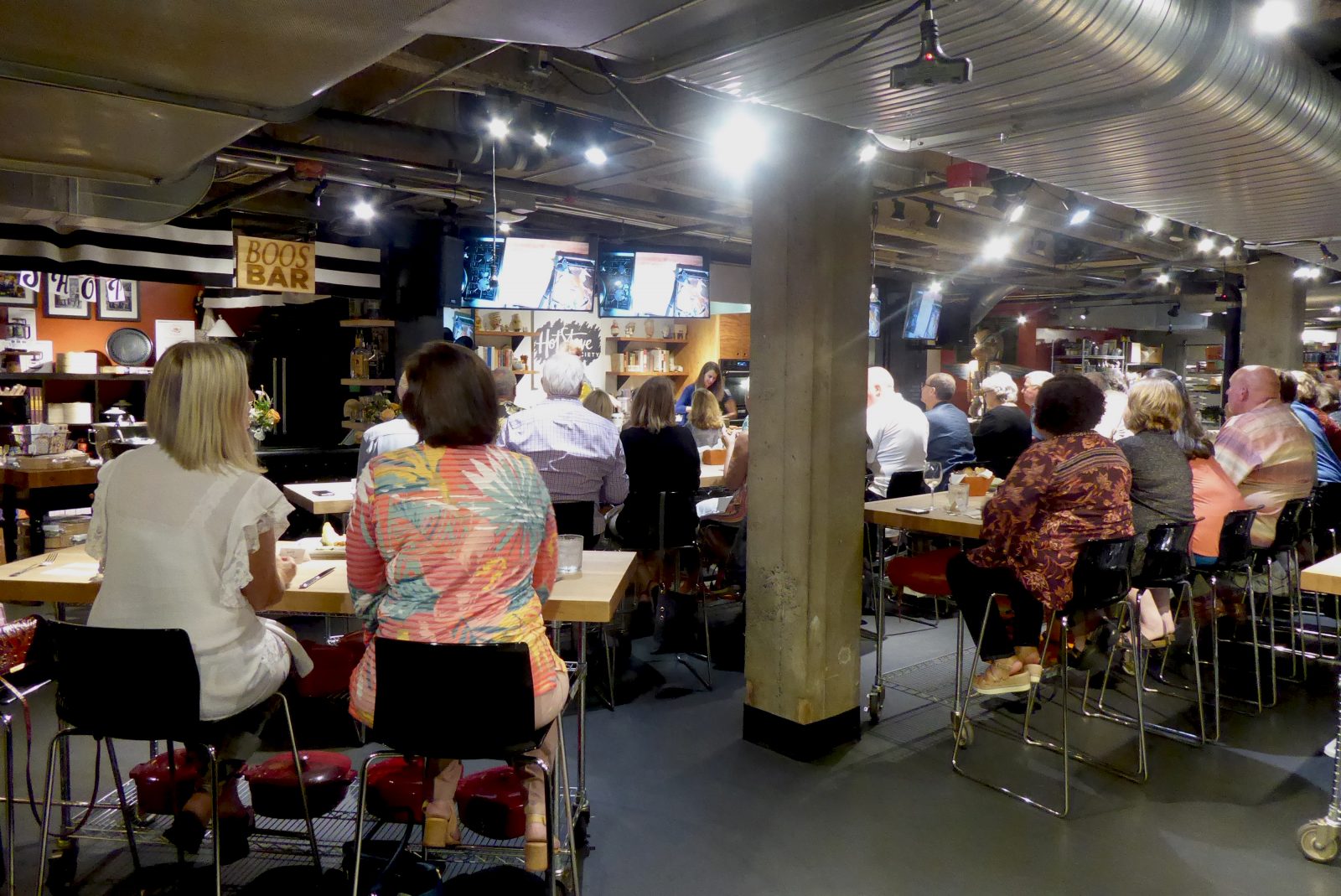 People gather at the Fish On! Fillet to plate cooking demo at the Hot Stove Society in Seattle.